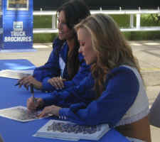 A pair of Dallas Cowboy cheerleaders working for Ford at the State Fair of Texas.