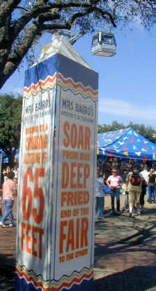A Texas Skyway Gondola high above sponsor Mrs. Baird's ad at the Midway at the Texas State Fair.