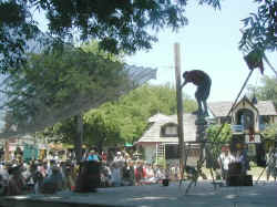 a juggler puts on a show in another part of the Scarborough Faire village...