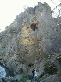 The cave in the cliff beside Turner Falls in Turner Falls Park.