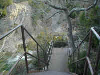 Stairways leading to caves and overlooks above Turner Falls.
