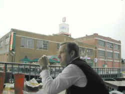 A tourist at a canal side Bricktown restaurant.