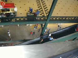 Way up high on an escalator in the Ballpark in Arlington.